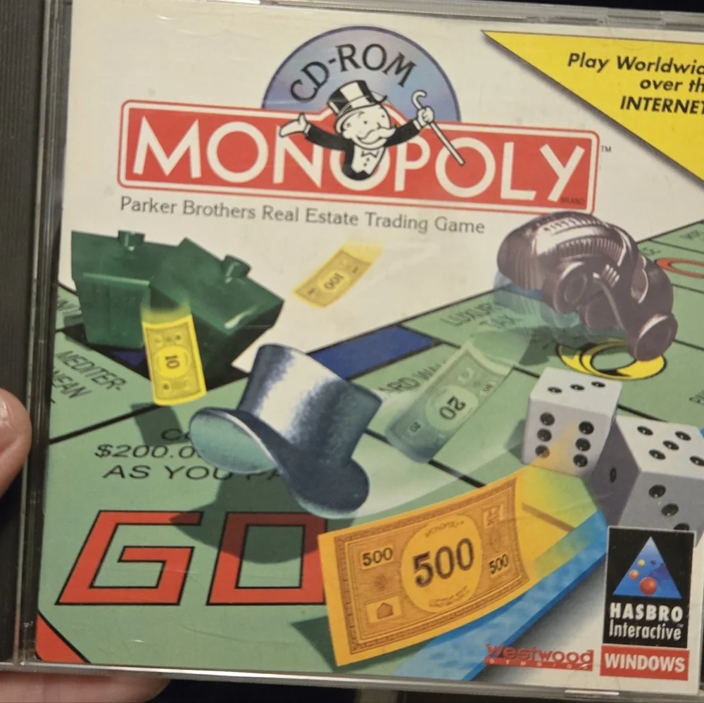 Hasbro Monopoly CD-ROM Game with Red and Blue Accents